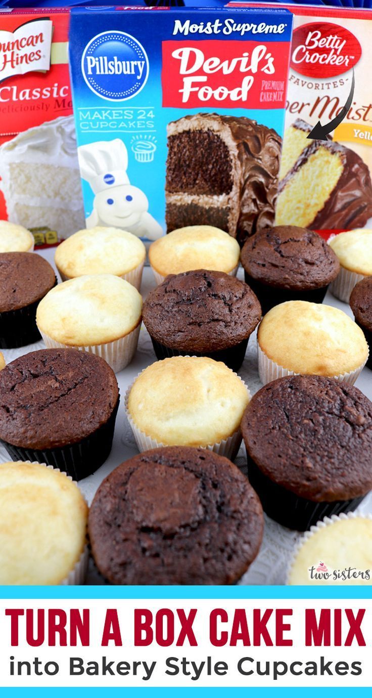 chocolate cupcakes with icing and frosting next to boxes of deli's food