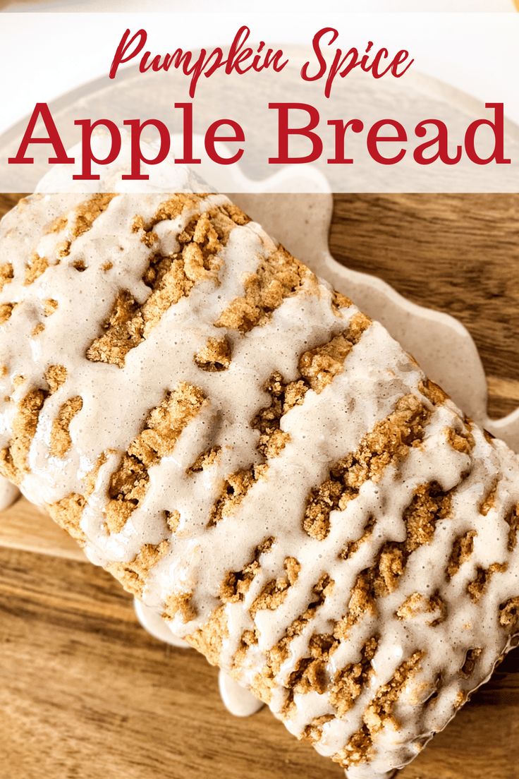 an apple bread with white icing on a wooden surface and text overlay that reads pumpkin spice apple bread