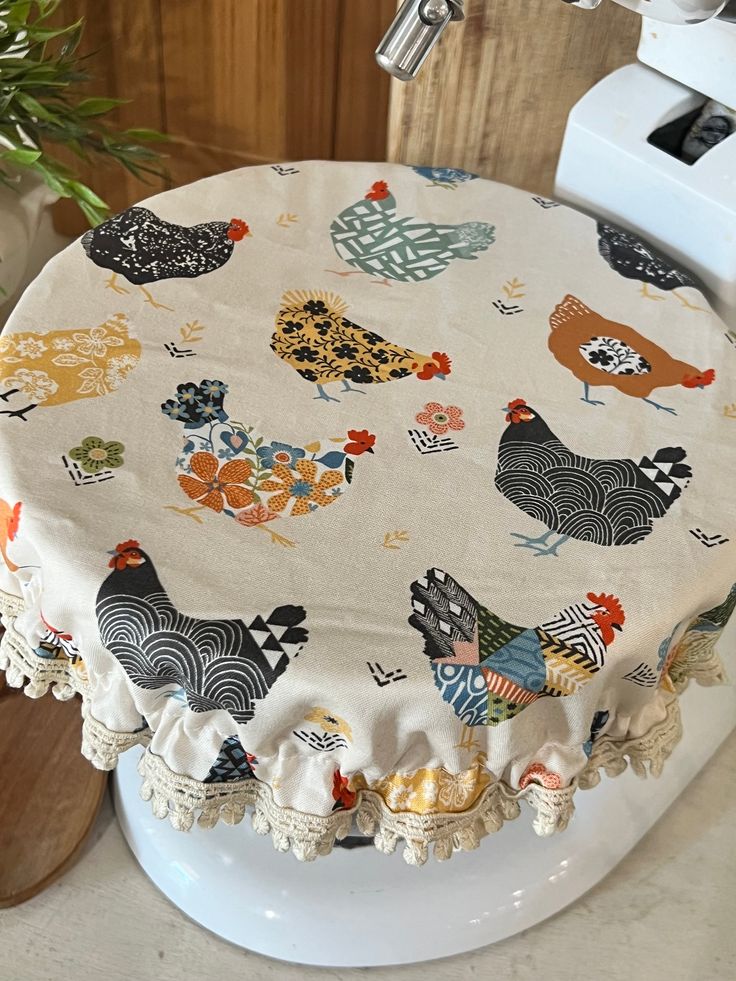 a cake with chickens on it sitting on top of a counter