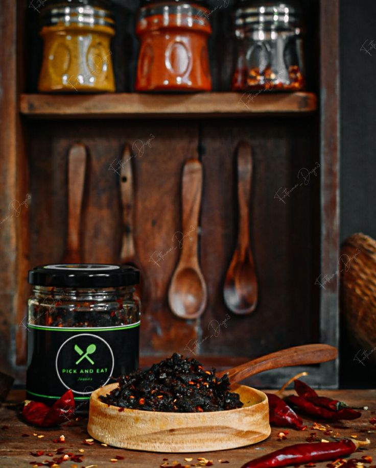 spices and spoons sit on a wooden table