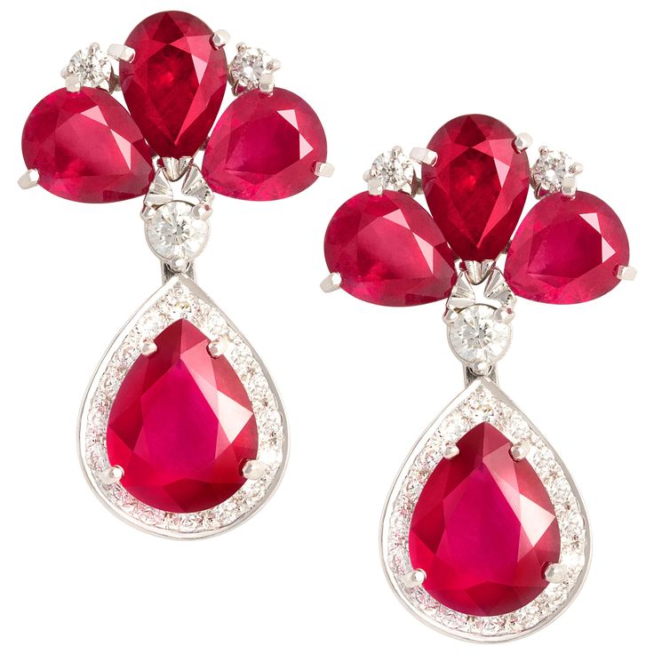 The ruby and diamond drop earrings feature 8 faceted drop shape African rubies of homogeneous brilliance for a total of 21.50 carats. The design is complete with 1.65 carats of top quality round diamonds (G-F/VVS, color, clarity and cut). The earrings are flexible just to the right extent. They were entirely hand made in 18 carat gold by maestro Scalabrì in our own workshop in Italy according to an original design by Ella Gafter. They are signed EG. Victorian Drop Earrings, Ruby And Diamond Earrings, Haute Jewelry, Jewellery Indian, Colored Stones, Spiral Earrings, Ruby Diamond, Diamond Drops, Bridal Jewellery