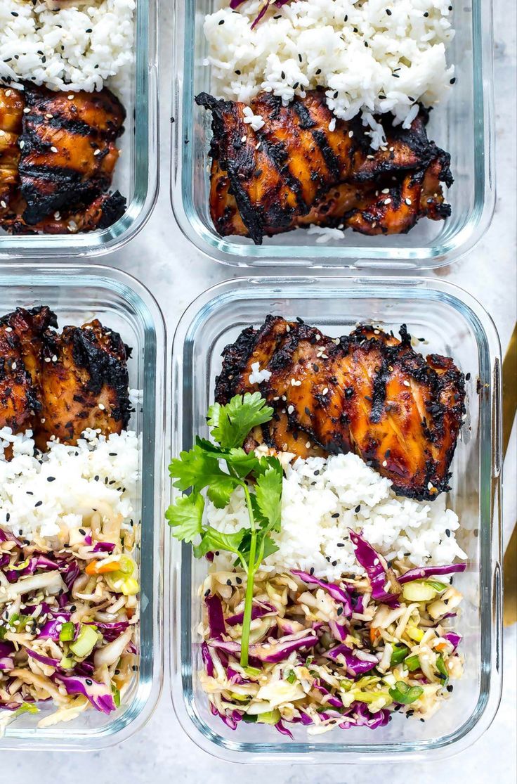 four glass containers filled with chicken, rice and coleslaw slaw salads