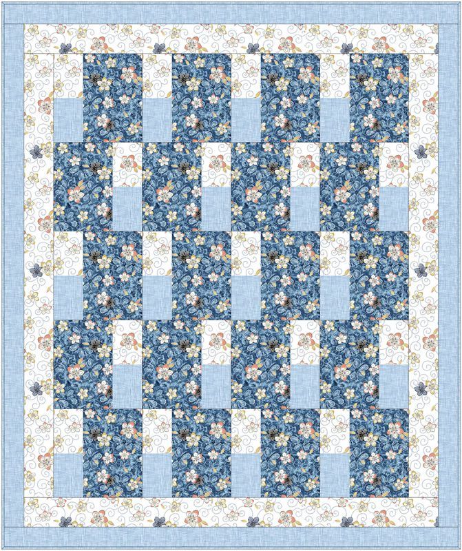 a blue and white quilt with flowers on it