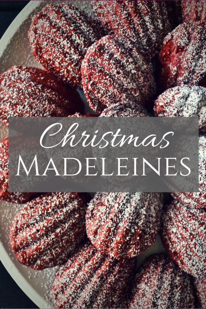 red velvet cookies on a plate with the words christmas madeleines