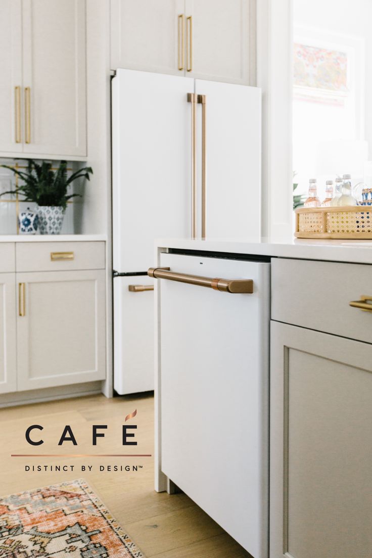 a white refrigerator freezer sitting inside of a kitchen