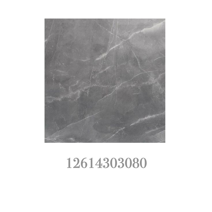 the back side of a gray marble tile with white lettering on it and an image of a