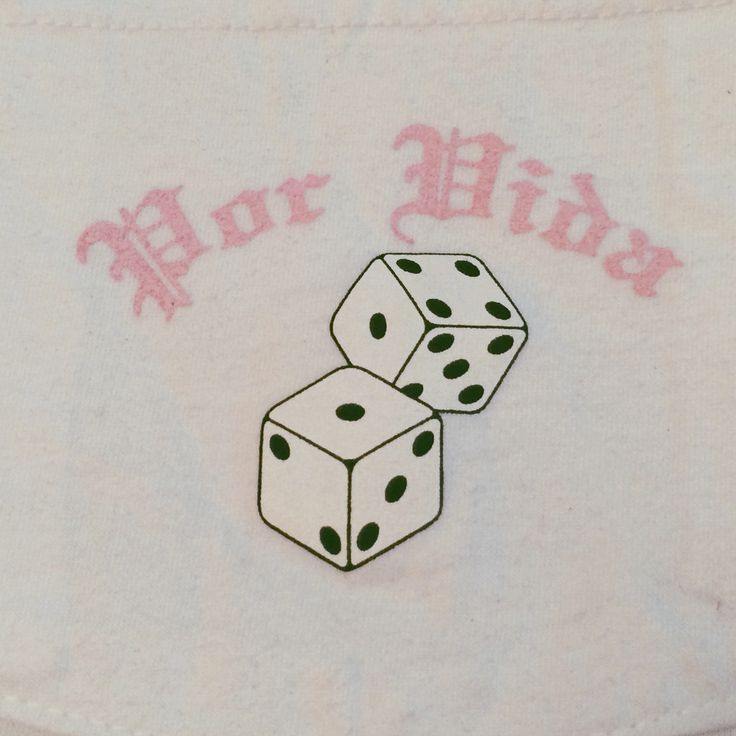 two dices sitting on top of each other in the middle of a white shirt