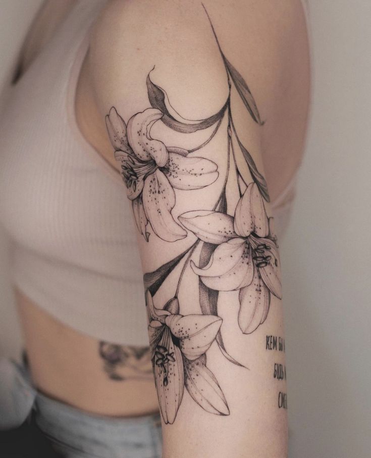 a woman's arm with flowers on it