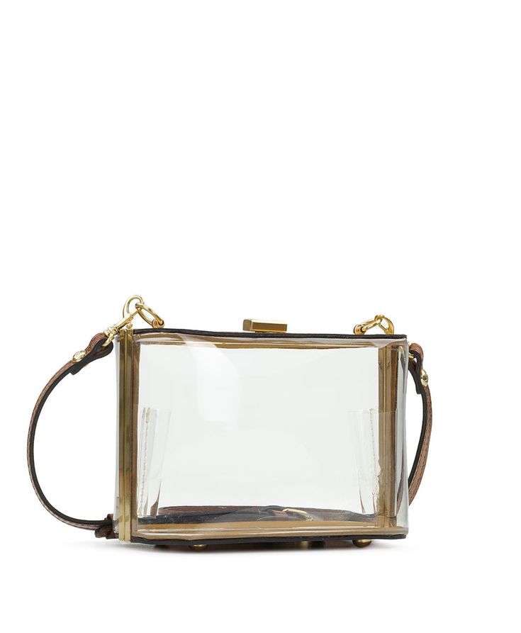 Lots of occasions now call for clear bags. From concerts to stadiums to museums, Patricia has proven that clear doesn't have to be ho hum, and the Anselma is a dainty bag that is sure to delight. With a hinged opening and push-latch closure, it is a great styling choice even if clear isn't a necessity. The full-grain leather strap is adjustable and detachable, so you've got carrying options. 100% PVC, 100% full-grain leather trim Interior: faux suede lining, 100% polyester at bottom of bag Exter Modern Clear Rectangular Shoulder Bag, Clear Rectangular Bag, Clear Rectangular Shoulder Bag, Modern Clear Rectangular Bag, Clear Satchel With Removable Pouch, Modern Clear Satchel Bag, Clear Rectangular Bag With Removable Pouch, Clear Rectangular Bag With Detachable Strap, Clear Top Handle Shoulder Bag For Everyday Use