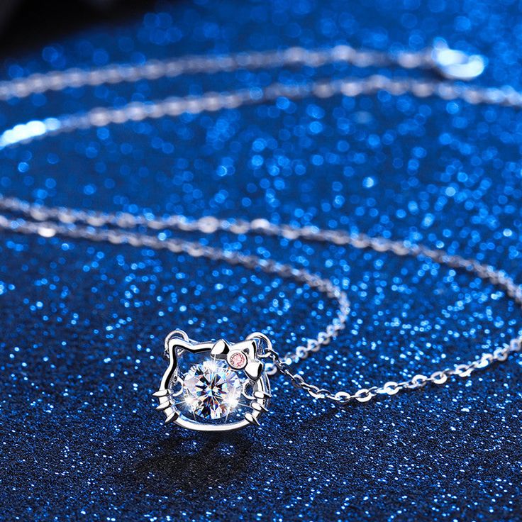 Description & Details Celebrate the elegance and mystique of our feline friends with our exquisite pieces. Each design in our collection is meticulously crafted to capture the grace and playfulness that make cats such beloved companions. • Material: Solid 925 Sterling Silver ∙ Cubic Zirconia• Finish: Hypoallergenic ∙ Gold Plating• Dimensions: 40 - 45 cm chain, adjustable• All our work is custom made by hand with love Hello Kitty Necklace, Kitty Necklace, Beating Heart, Cat Charm, Charm Pendant Necklace, Cat Necklace, The Grace, Cute Pink, Solid 925 Sterling Silver