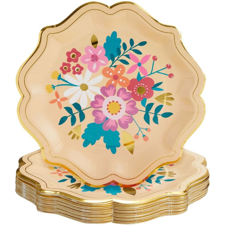 a set of four plates with colorful flowers on them