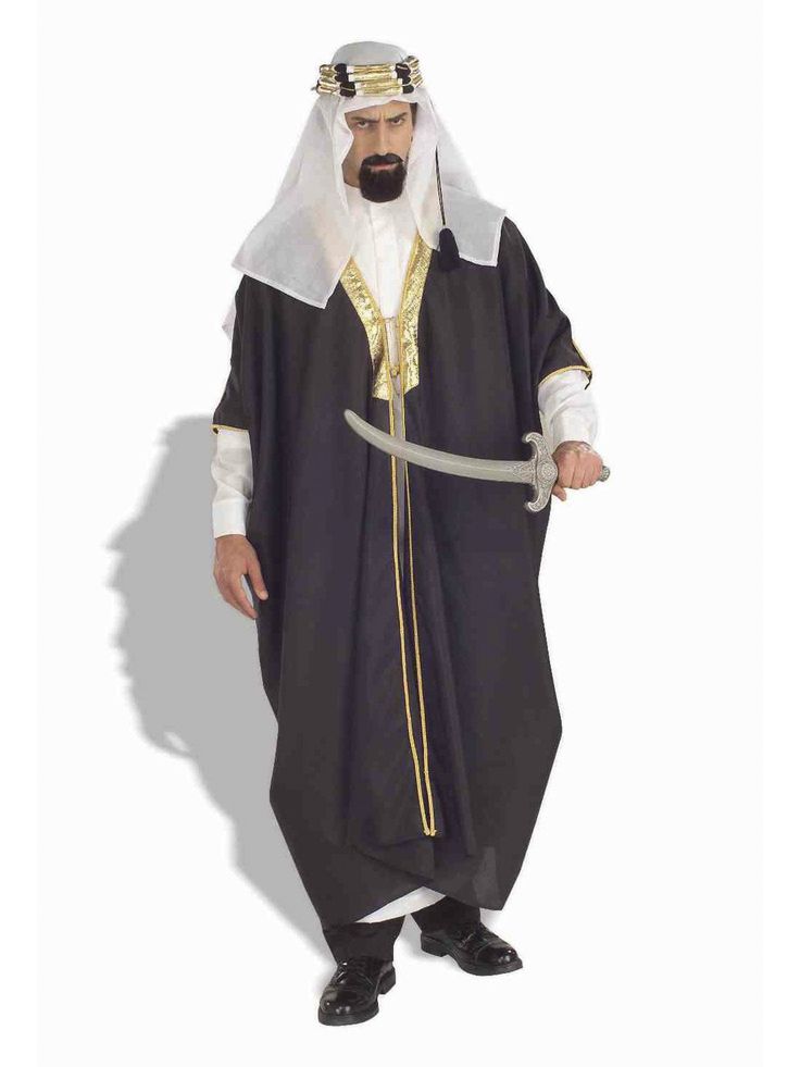 The Men's Arab Sheik Costume consists of a three piece set. The dark brown robe featured a golden trim on the chest and down the middle, adding intricate detail. The robe is able to fit most adult male sizes. The costume also includes a headpiece with a mock gold jeweled ring and a white underrobe. All three pieces included in the costume set are made from one hundred percent polyester. Genie Dress, Mens Fancy Dress, Arabian Nights, Matching Headband, Fancy Dress Costumes, Mens Costumes, Long Sleeve Tunic, Adult Costumes, Fancy Dress