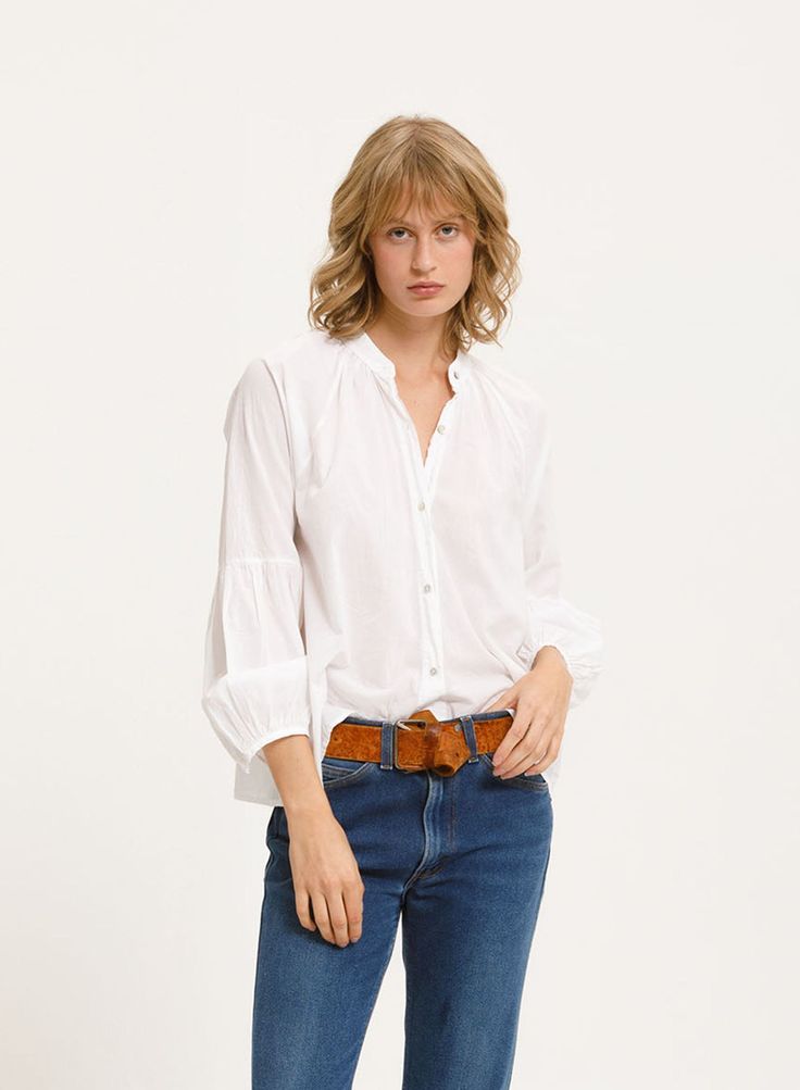 Designed after a Queen, the BOLEYN SHIRT is our take on the exemplary peasant style blouse. This style features a distinctive sleeve detail and gathered look at the cuff for a regal feel. Completed with shell-style buttons and a relaxed fit around the waist for a polished look with an easy, effortless fit. (Rope belt sold separately). Hand or machine wash. Flat or line dry, or lightly tumble, avoid over drying. Chic Puff Sleeve Blouse For Gatherings, Relaxed Fit Blouse With Cuffed Sleeves For Fall, Fall Puff Sleeve Blouse For Gatherings, Puff Sleeve Blouse For Fall Gatherings, Gathered Sleeves Blouse For Gatherings, Spring Bishop Sleeve Blouse With Button Cuffs, Classic Fall Blouse For Casual Gatherings, Relaxed Fit Blouse With Smocked Puff Sleeves, Relaxed Fit Blouse With Smocked Cuffs And Puff Sleeves