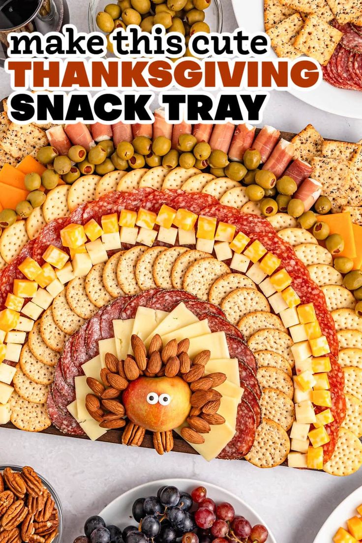 a turkey made out of crackers, grapes and nuts with the words make this cute thanksgiving snack tray