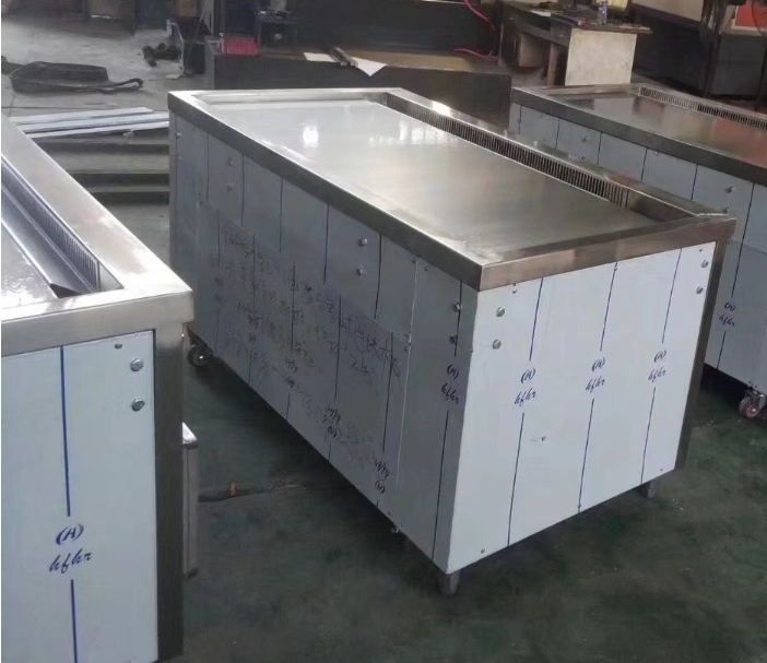 an industrial kitchen with stainless steel counter tops and cabinets in the background at a factory