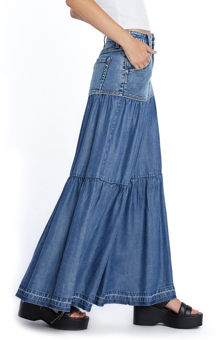 Perfect your casual-cool vibe in this denim maxi skirt designed with flouncy tiered ruffles. 37 1/2" center front length (size 29) Unlined 66% cotton, 22% REPREVE® recycled polyester, 8% polyester, 3% rayon, 1% spandex Machine wash, tumble dry Imported Denim Bohemian Maxi Skirt, Bohemian Denim Maxi Skirt, Flowy Denim Tiered Skirt, Flowy Tiered Denim Skirt, Summer Denim Tiered Maxi Skirt, Denim Tiered Maxi Skirt For Summer, Casual Fitted Tiered Maxi Skirt, Casual Long Skirt With Ruffle Hem, Flowy Long Denim Skirt