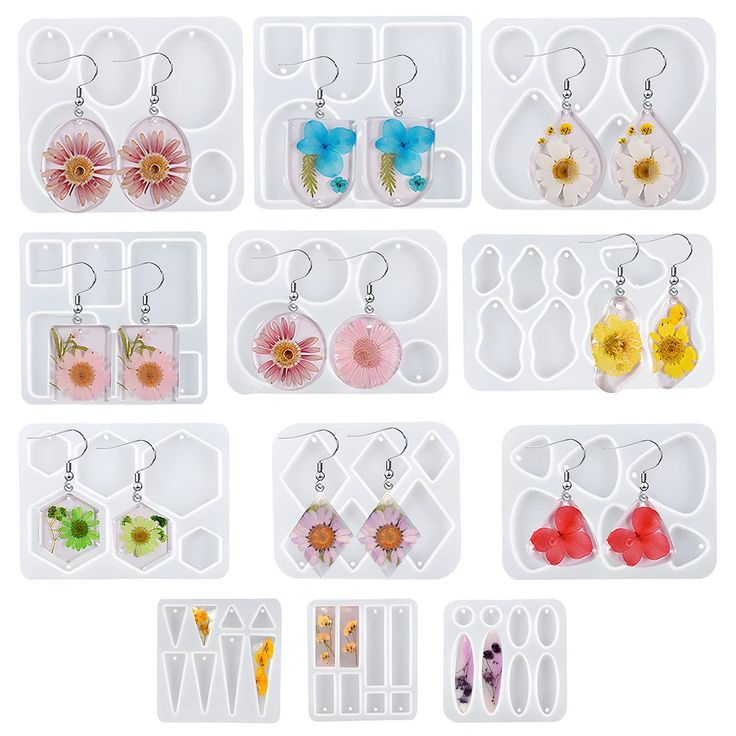 twelve pairs of earrings are shown in the shape of flower petals and dangles