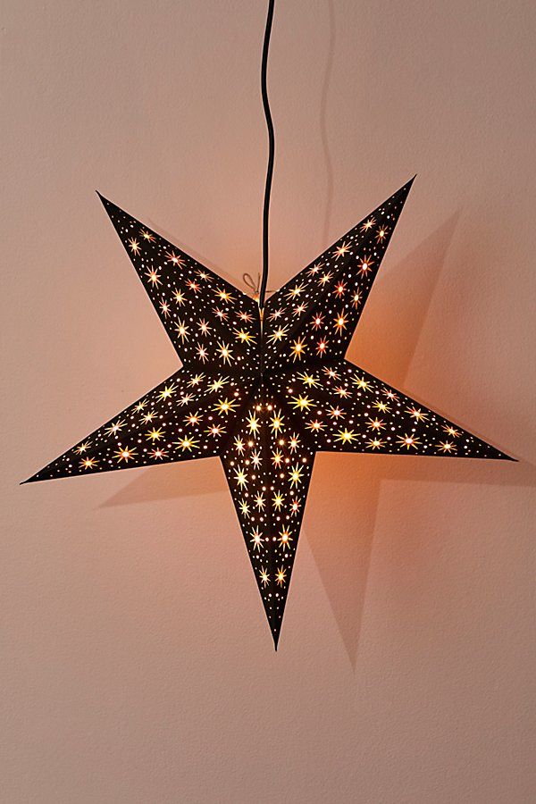 a star shaped light hanging from the ceiling