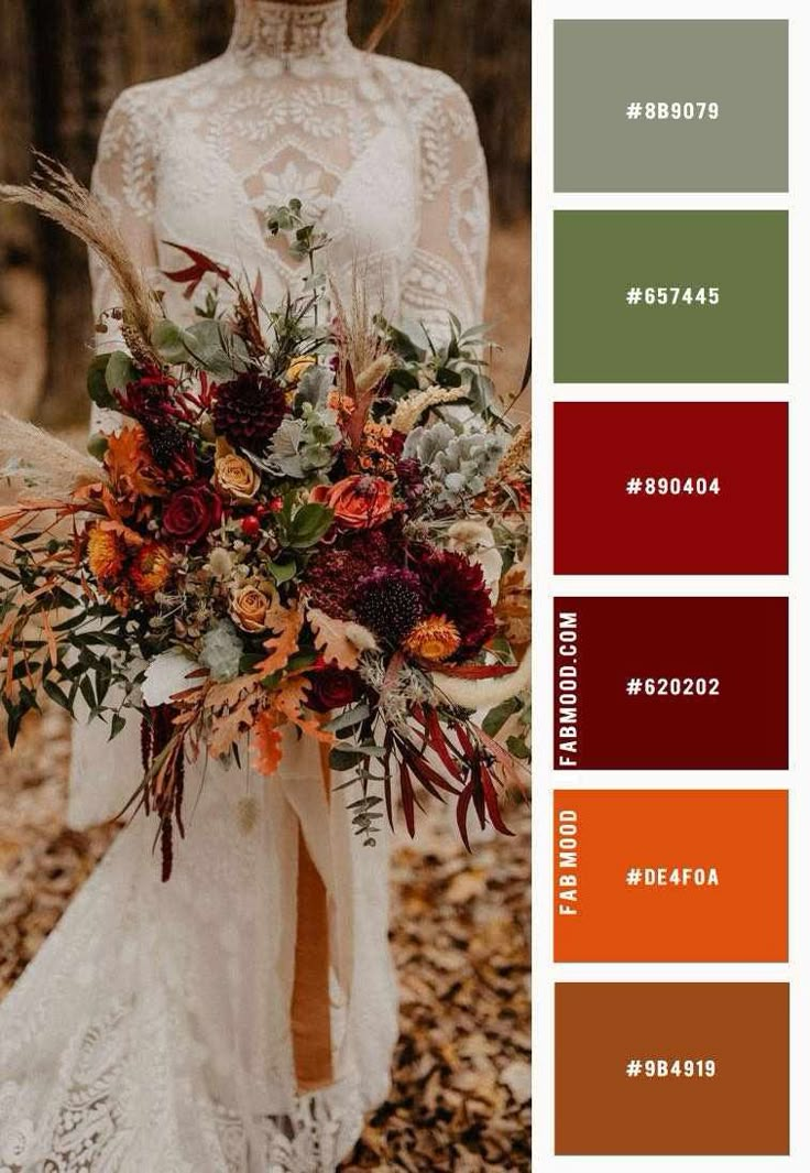 a bride holding her wedding bouquet in the woods with autumn colors and greenery to match