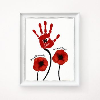 a red handprint with the words we don't care and two poppies