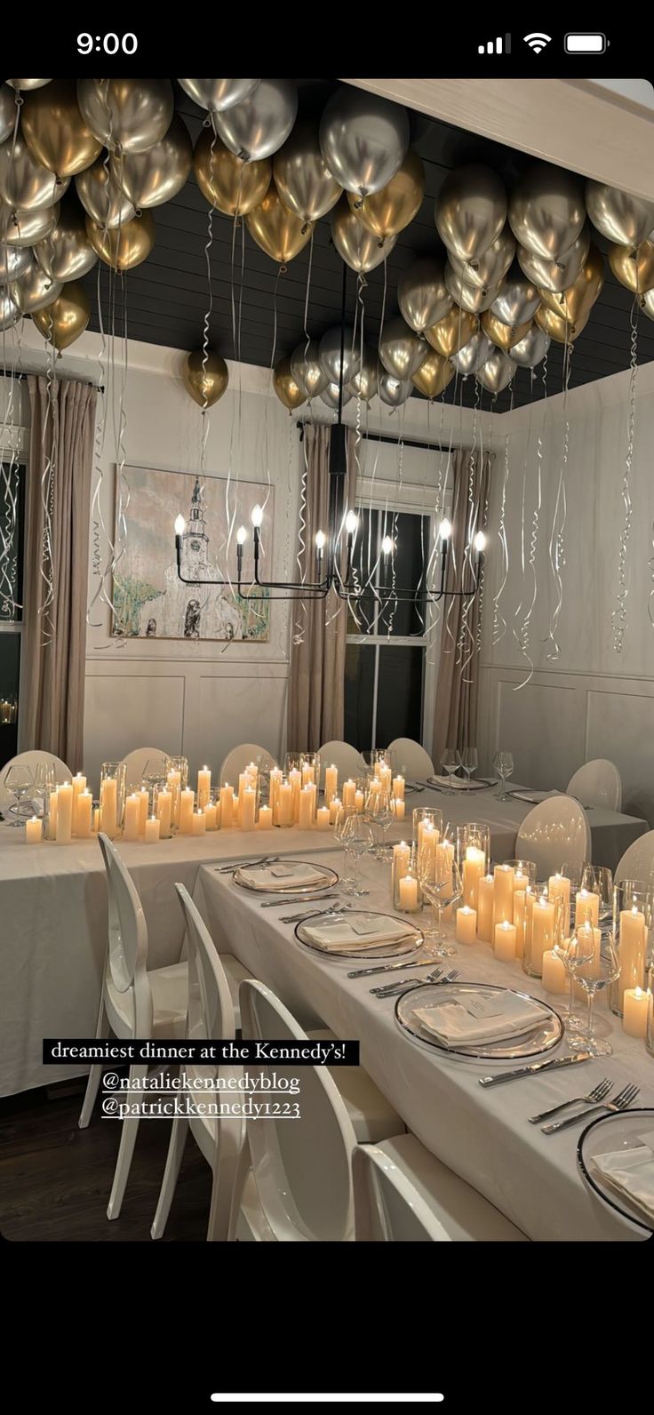 a dining room filled with lots of tables covered in white table cloths and gold balloons