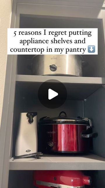 an open shelf with pots and pans on it