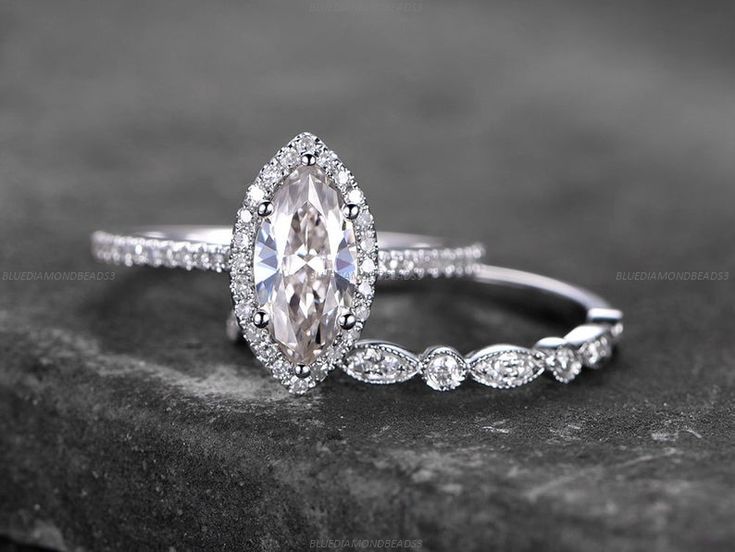 an oval shaped engagement ring with diamond accents