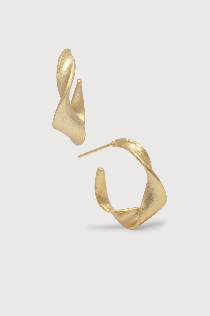 Warped Hoop Earrings Gold Gold Wrap Earrings With A Modern Twist, Gold Earrings With A Modern Twist, Chic Twisted Hoop Earrings, Modern Twist Wrap Earrings As A Gift, Modern Twist Wrap Earrings For Gift, Modern Twist Small Hoop Earrings, Minimalist Twisted Gold Hoop Earrings, Gold Twisted Hoop Earrings Minimalist Style, Minimalist Gold Twisted Hoop Earrings