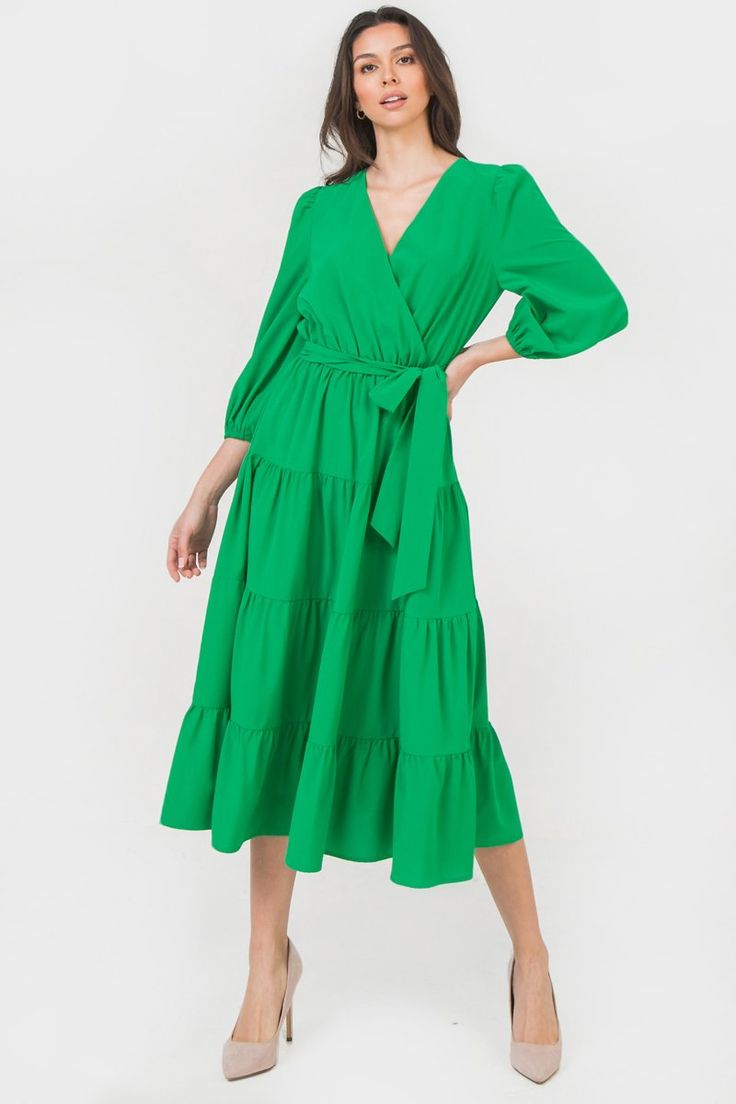 A solid midi dress featuring surplice neckline, 3/4 sleeve, elasticized waist with self sash belt Details Self 97% Polyester, 3% Spandex Lining: 100% Polyester Size & Fit - Model is 5`8" And Wearing Size Small - Measurements Taken From Size Small - Approx. Length: 46" Modest V-neck Midi Dress For Spring, Solid Knee-length V-neck Dress For Spring, Solid Spring Knee-length V-neck Dress, Midi Length V-neck Dress For Spring Workwear, Chic Solid Midi Dress With Surplice Neckline, Chic Midi-length V-neck Dress In Solid Color, Chic Midi Dress With Surplice Neckline, Chic Solid Dresses With Surplice Neckline, Chic Solid Color Midi Length Wrap Dress