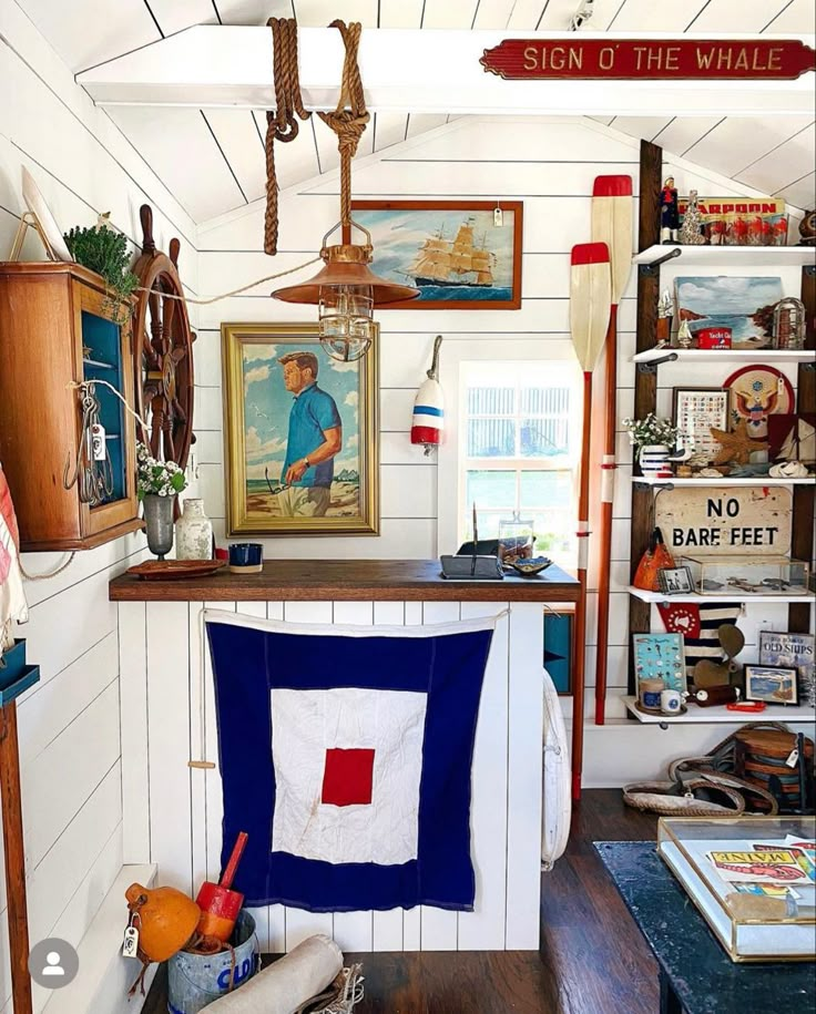 a room filled with furniture and pictures on the wall