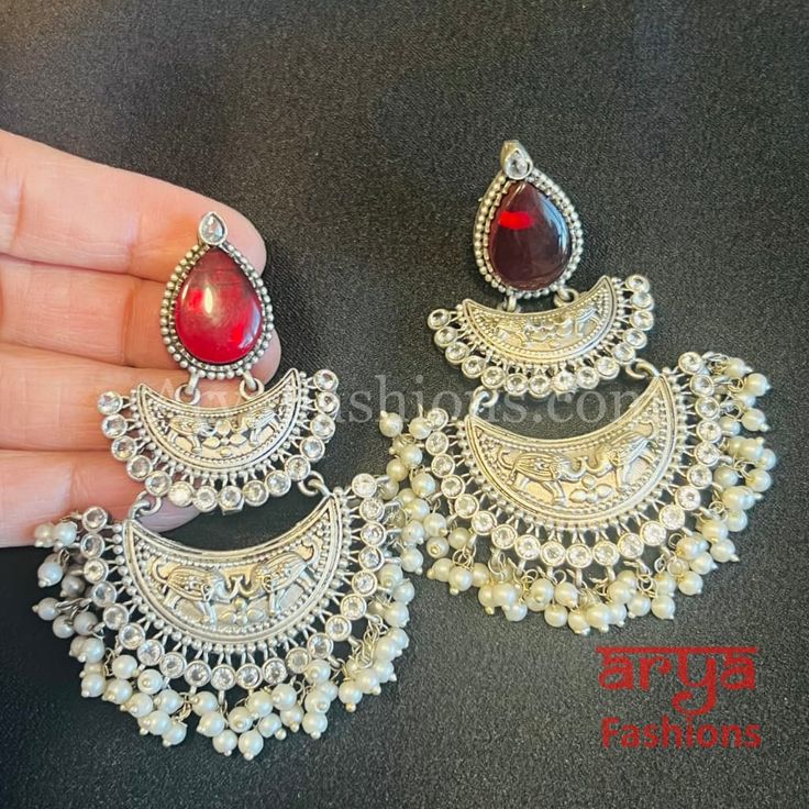 Mehza Silver Oxidized Chandbali Earrings Made in Brass with Silver Finish with Pearls, CZ and colored stones Very Elegant and stylish, these earrings can be paired with any traditional Indian or Western Attire depending upon the occasion and the theme. Length: Approx. 3 Inches Light-weight Earrings Earrings come with Push Back Closure In-stock & ready-to-ship **Color may vary slightly due to photography and lighting. Pick-up available for this item at Glen Allen, Virginia (Usually ready between Earrings With Stones, Oxidized Silver Earrings, Chandbali Earrings, Colored Stones, Oxidized Silver, Traditional Indian, Light Weight Earrings, Stone Color, Favorite Jewelry