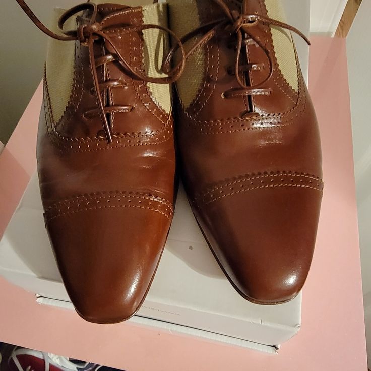 Beautiful Never Worn. The Indentations In The Leather Are From Storage. These Are A 7.5b But Are More Suited For A Size 6.5 Or 7. No Box, But Will Be Carefully Wrapped In Tissue Paper. Smoke Free Yorkie Friendly Home. Reasonable Offers Welcome. A 5-10% Offer Will Usually Be Accepted. 15% Will Be Considered. Please Don't Waste My Time Asking For A 20% Offer On Low Price Items. Pm Take 20% Of Every Sale And I Already List My Items At Low Prices. Brown Closed Toe Oxfords For Galas, Designer Oxfords With Brogue Detailing And Almond Toe, Brown Oxfords With Almond Toe And Rubber Heel Cap, Brown Almond Toe Oxfords With Rubber Heel Cap, Designer Calf Leather Oxfords With Almond Toe, Classic Beige Closed Toe Oxfords, Fitted Brown Oxfords With Removable Insole, Designer Almond Toe Calf Leather Oxfords, Classic Beige Leather Shoes With Almond Toe