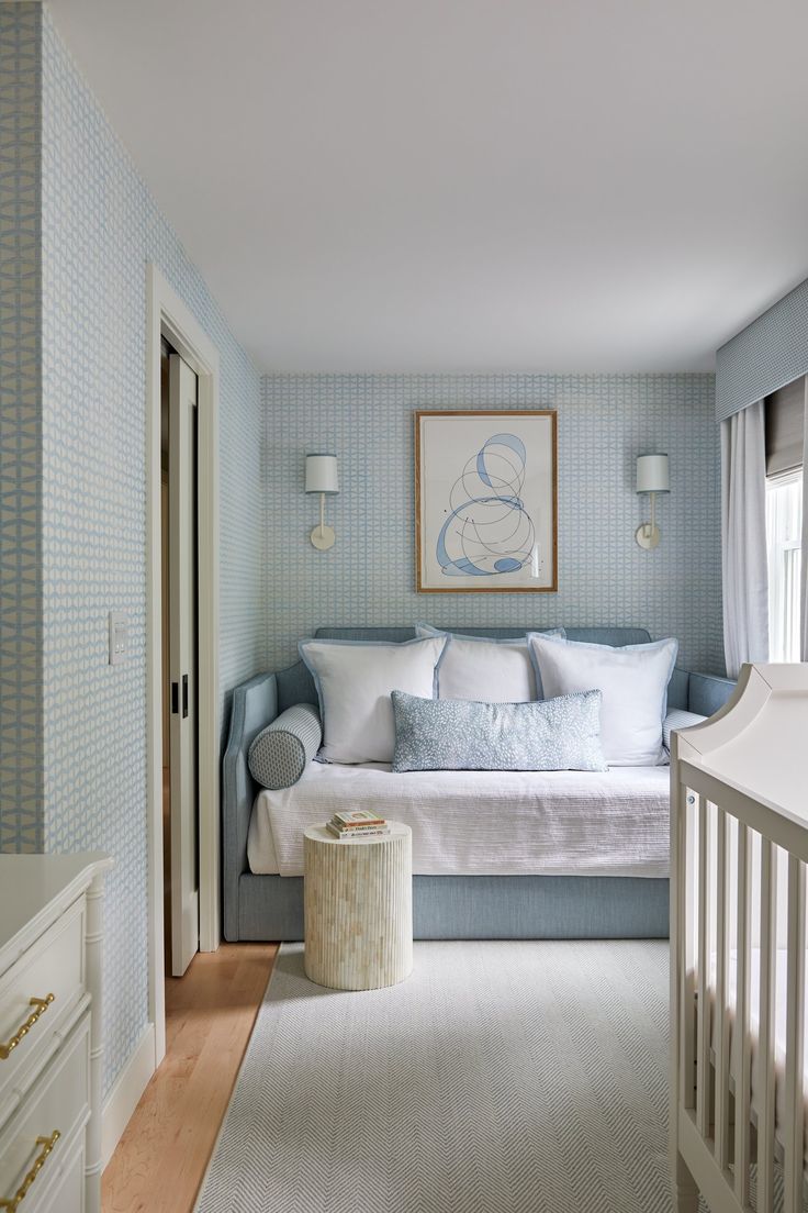 a bedroom with blue and white decor in it