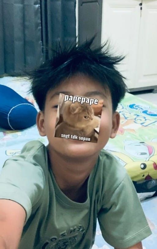 a young boy with an ad on his face that says napepane, but did someone say it?