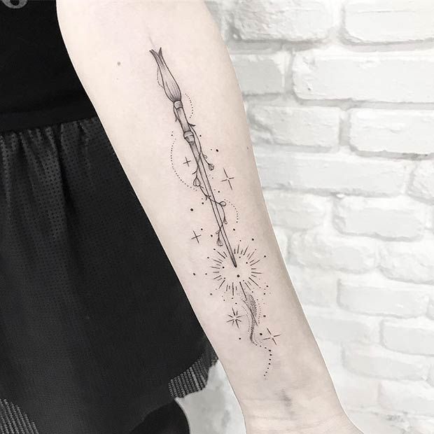 a woman's arm with a tattoo on it that has fireworks coming out of it