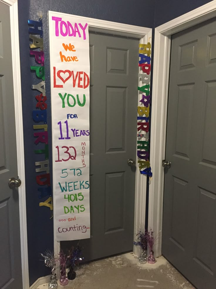 two doors are decorated with colorful ribbons and congratulations signs for the school's students