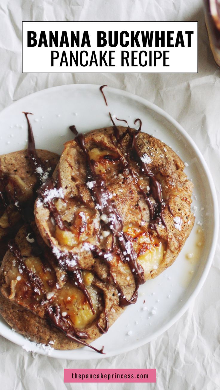 banana buckwheat pancakes on a plate with chocolate drizzled over them