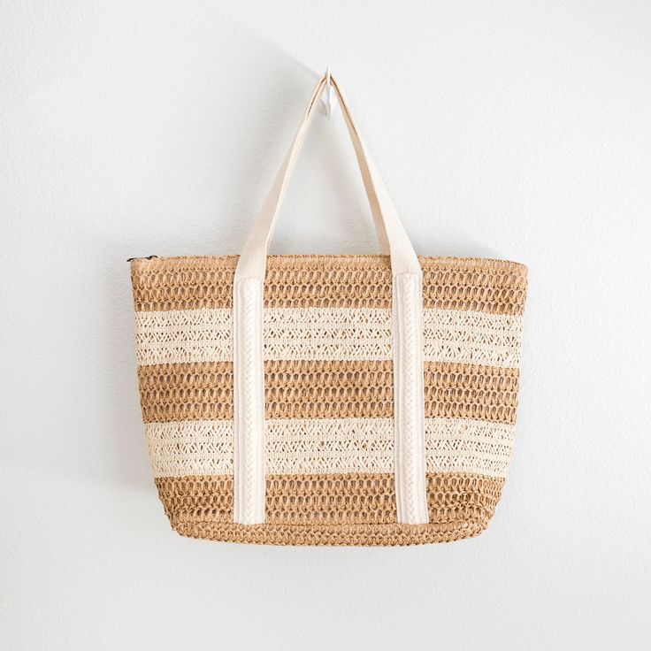 In Stock! Fast Shipping from Los Angeles! Soar to new fashion heights with Elena's Handbags Straw Woven Beach Tote! Large enough to accommodate all your essentials - and some - this bold and beautiful tote is perfect for beach days, poolside lounging, and making a strong style statement. Take a risk and go for the wow! Size: 35cm wide x 30cm tall (14in x 12in) Zipper Closure Designer Style ID: 8360 Large Straw Woven Tote Bag, Summer Bag, Everyday Shoulder Bag, Beach Bag Large Capacity Tote Beach Bag For Vacation, Large Capacity Summer Beach Tote Bag, Beachy Woven Bag For Vacation, Summer Lightweight Tote Beach Bag, Lightweight Tote Beach Bag For Beach Season, Beachwear Bags For Everyday Use In Beach Season, Summer Tote Beach Bag For Vacation, White Lightweight Beach Bag For Vacation, Lightweight White Beach Bag For Vacation