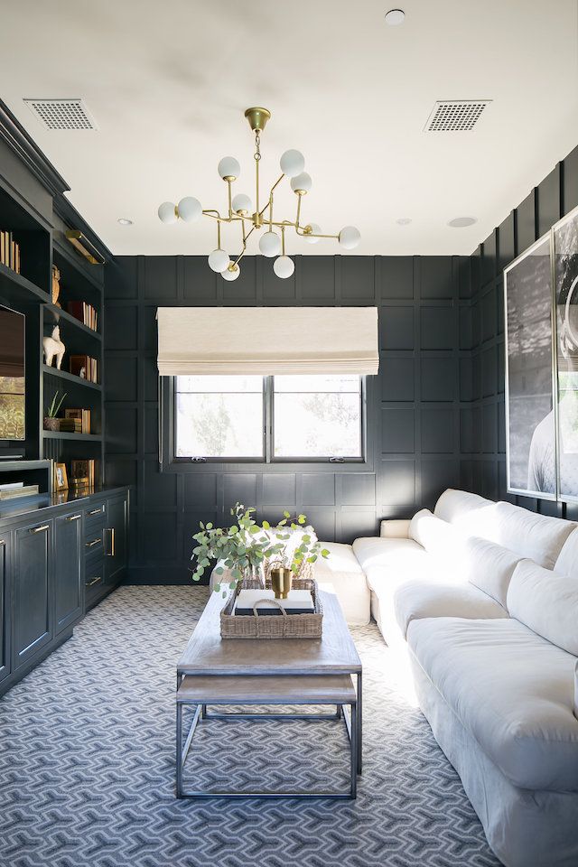 the living room is decorated in black and white