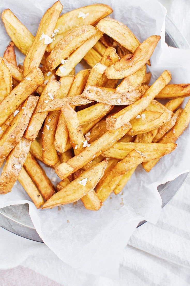 french fries with salt and pepper on top