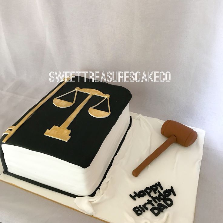 a birthday cake with a book and gavel on it for a law enforcement officer