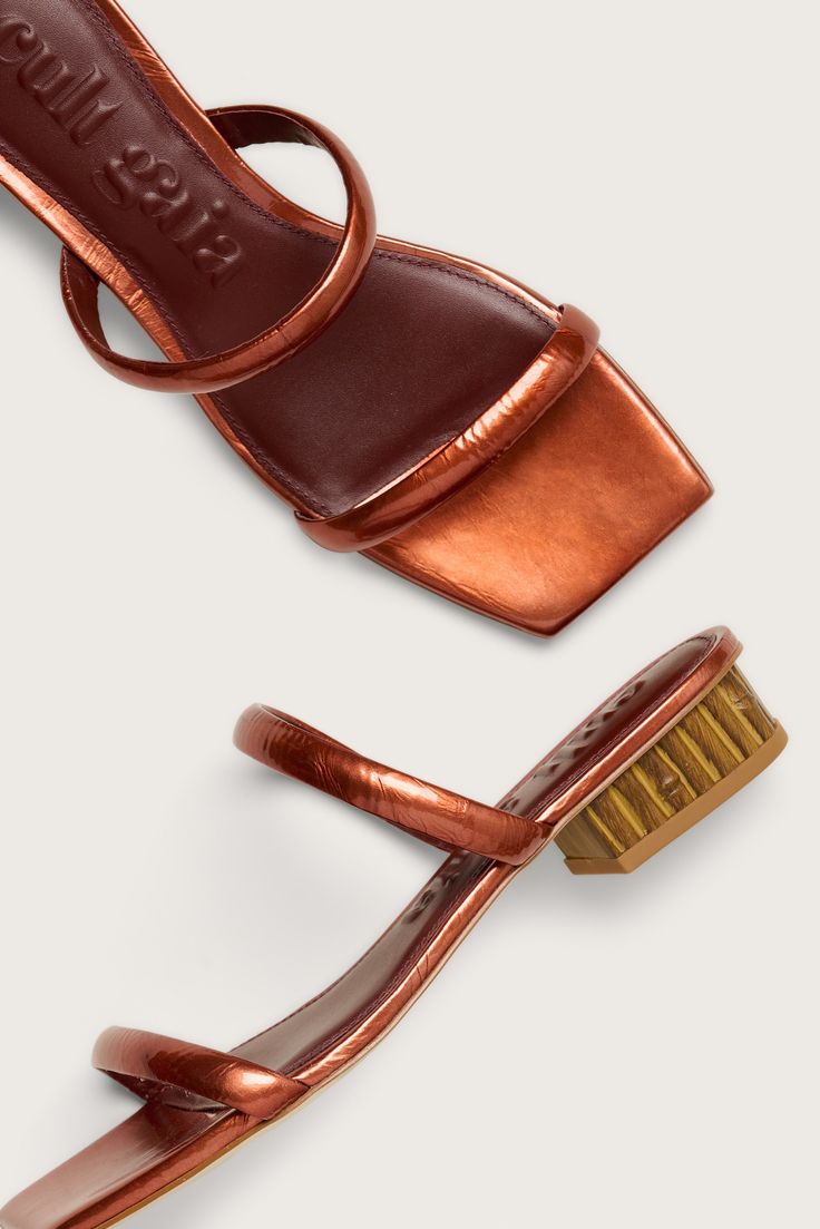 A square-toed sandal in Sienna-hued glazed leather with a bamboo-style, low heel.• Glazed leather straps and sole• Square toe• Low, bamboo-style heel• Metallic glazed leather Swimming Bag, Cult Gaia, Kids Sandals, Accessories Jewelry Earrings, Lifestyle Brand, Leather Jewelry, Clothing For Women, Kids' Dresses, Low Heels