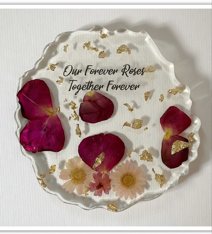 a white plate with flowers on it that says our forever roses together forever and gold flecks