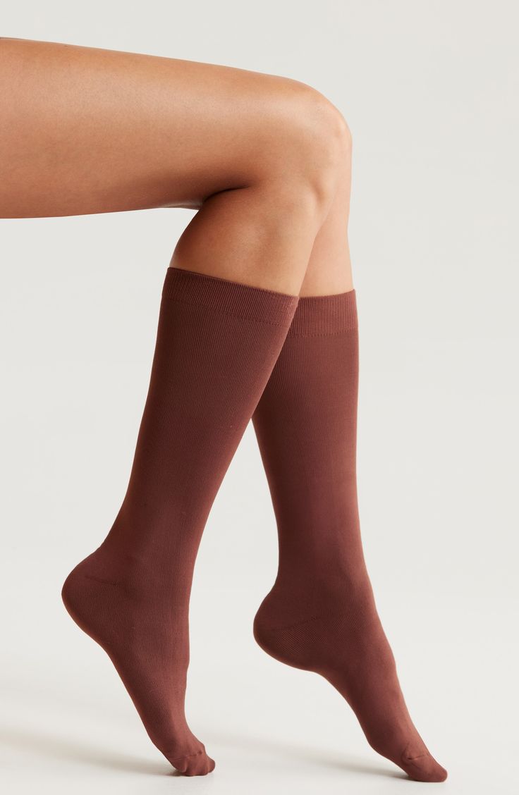 Signature nonbinding comfort is the hallmark of smooth, sleek socks topped with a soft cuff for a no-slip fit. Polyester/spandex Machine wash, tumble dry Imported Solid Stretch Knee-high Socks, Solid Color Stretch Knee-high Socks, Fitted No-show Socks With Arch Support, Solid Mid-calf Stretch Hosiery, Mid-calf Solid Color Stretch Hosiery, Micro-elastic Solid Mid-calf Hosiery, Comfortable Fitted Slip-resistant Socks, Stretch No-show Socks With Arch Support, Comfortable Stretch Knee-high Hosiery