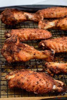 grilled chicken wings on a baking tray ready to be cooked in the oven for consumption