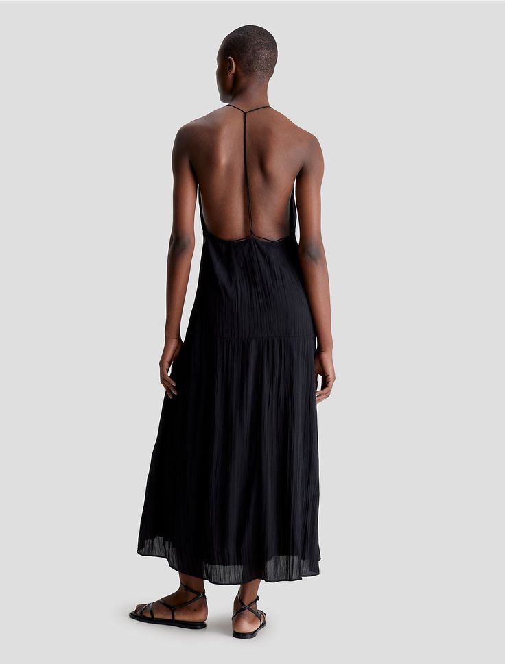 Cut in a maxi length, this slip dress is accentuated with an open back design and features fine pleated styling throughout. Made with a sleeveless silhouette and a V-neckline. Crafted completely from recycled polyester for a sustainable design.  Material: 100% Recycled Polyester. Midi Slip Dress, Maxi Slip Dress, Back Design, Sustainable Design, Midi Length, Open Back, Hair Makeup, Slip Dress, Calvin Klein