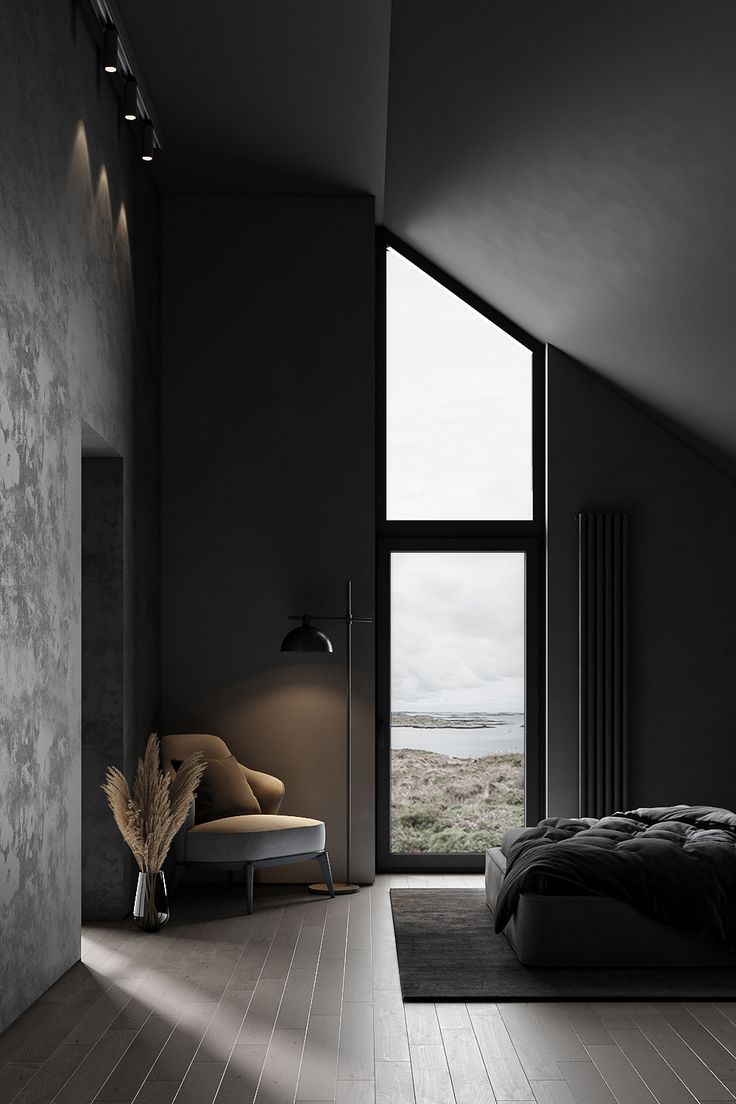 a bedroom with a large window overlooking the ocean is shown in this black and white photo