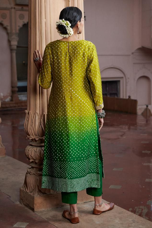 Green ombre effect bandhani print kurta with floral embroidered yoke. Paired with a pant and scallop trimmed dupatta.
Components: 3
Pattern: Print
Type Of Work: Bandhani
Neckline: Round Neck
Sleeve Type: Three Quarter Sleeves
Fabric: Moonga Silk, Organza 
Color: Green
Other Details: 
Embroidered buttis on dupatta
Occasion: Puja - Aza Fashions Bandhani Print, Kurta Set For Women, Pink City, Straight Kurta, Green Ombre, Organza Dupatta, Ombre Effect, Kurta With Pants, Silk Organza