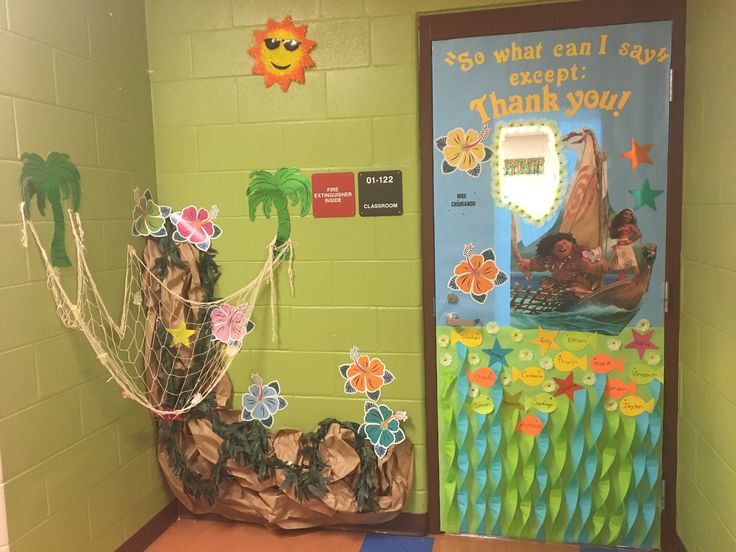 a classroom door decorated with paper flowers and decorations