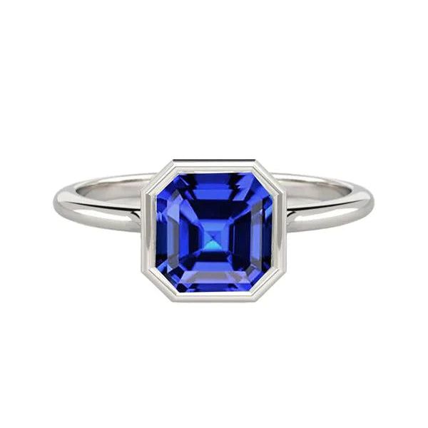 Bezel Set Asscher Sapphire Ring For Women METAL SPECIFICATIONS White Gold 14K STONE SPECIFICATIONS Stone Name : Blue Sapphire Stone Cut : Asscher Stone Details : There is one asscher cut sapphire approx. 2 carats (Approx. Size 8 x 6 mm) in the ring. Natural earth mined stone. Quality of Sapphire : AAA Total : Approx. 2 Carats RING SPECIFICATIONS Size : 6.5 (Can ship in any size, please send us a message about size after placing the order) Appraised Value : $6,498.00 Comes with Certificate Laos Jewelry, Blue Sapphire Engagement Rings, 2 Carat Ring, Blue Sapphire Stone, Sapphire Solitaire Ring, Vintage Inspired Rings, White Gold Solitaire, Gold Solitaire Ring, Sapphire Solitaire